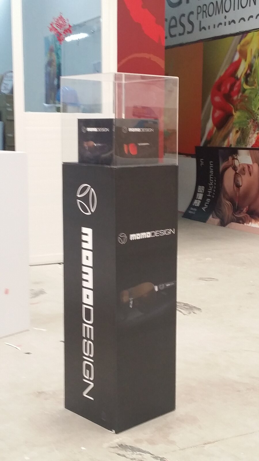 Black illuminated branded display plinth